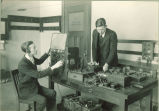 Students operating electrical apparatus in Physics laboratory, The University of Iowa, 1920s