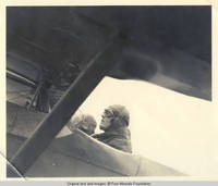 Unknown woman sitting in airplane