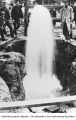 Men around gushing well, Belle Plaine, Iowa, late 1890s or early 1900s