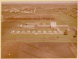 Aerial view of various farm buildings and facilities, 1960