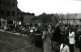 A crowd waiting for news of lawn display winners, Homecoming, 1977