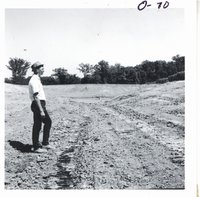 Roger Hansen inspecting Bernard Steffen's waterway and pond, 1968