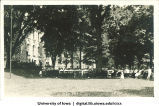Crowd seated in shade listening to speaker on Class Day, The University of Iowa, 1920