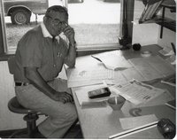 Roger Fry Sits at Desk