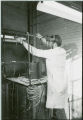 Researcher in full-face shield,1976