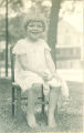 Girl sitting outside on chair, The University of Iowa, 1920s