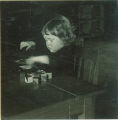 Toddler playing with a puzzle, The University of Iowa, 1920s