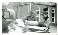 Three Men Loading a Truck