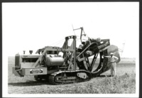 Gilbert Wehrman Leans Against a Tilling Machine