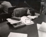 Student napping in the library, 1957
