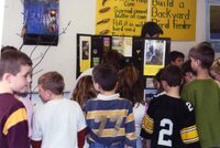 Students make pine cone bird feeders