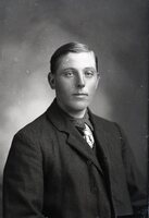 Man in coat, seated
