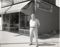 Man stands in front of feed store