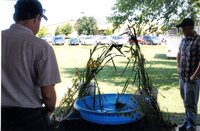 2008  Fair Booth worker Daryl Boulware tends to water display