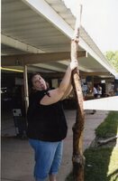 2009  Fair booth worker Jamie Grimes holding support pole for display booth