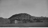 Residence of Messrs. Payne and Arnold  at the base of a hill near Minnekahta, Minn., late 1890s or early 1900s