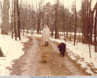 Elizabeth wearing fur coat, walking with cory and Sadie 