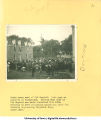 Crowd watching men climb an electric utility pole between the Old Capitol and Armory, The University of Iowa, 1920s