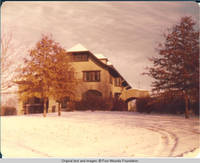 View of Grey house and car port in Winter