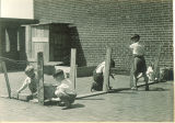 Students putting up a chicken fence, The University of Iowa elementary school May 1932