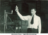 Firing a starting gun in Field House, The University of Iowa, 1920s