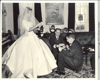 Frindy, unknown children, unknown man, unkown woman and John in parlor looking at correspondance