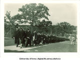 Commencement procession walking east on Pentacrest, The University of Iowa, June 1931