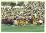 Scottish Highlanders performing at football game, The University of Iowa, November 1966