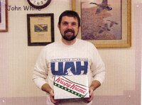 Staff holding doughnuts