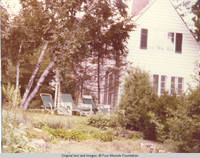 Lawn furniture on lawn next to patio and Rock garden