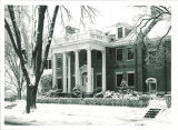 Front porch of the university president's house in winter, The University of Iowa, 1930s