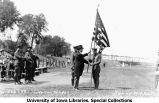 Governor N.E. Kendall receiving colors on Iowa Field, The University of Iowa, May 13, 1922