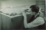 Engineering student working on model of building, The University of Iowa, 1940