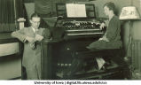 Station manager Carl Menzer and staff organist in radio broadcast, The University of Iowa, 1920s