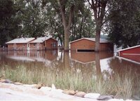 1993 - Flood water surrounds houses by river