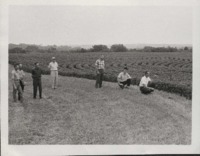 Group of Men Examine Keith Gaumer's Farm.
