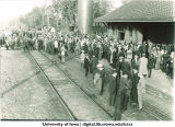 Crowd gathered at depot waiting for football train, The University of Iowa, 1913