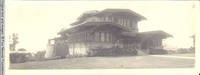 John V. Rider in front of his home in California