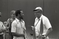 1978  William Baugh talks with John Wagenbach and other farmers in field during no-till corn field tour
