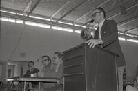 1976  Men at microphone 
