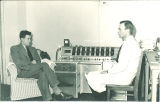 John R. Knott, right, with machine, The University of Iowa, 1947
