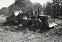 1970s Earthmoving machinery in field