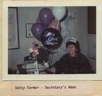 Betty Farmer Receives Flowers for Secretary's Week.