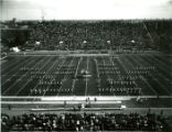 The ISU Marching Band in ""I"" formation on the football field at Homecoming, 1974