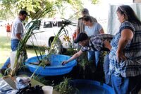 2008  Fair booth workers  Jay Jamison and Daryl Boulware talk with two women and another man at water plant display