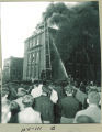 Crowd watching firefighters battling the fire at the Chemistry-Botany Building fire, The University of Iowa, September 1953