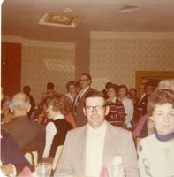 Mr. and Mrs. Phil Melvin sit at a dinner table during a conference