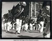 Band marching before Diamonds Cafeteria