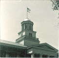 Flag flying over Old Capitol dome, The University of Iowa, 1920s?