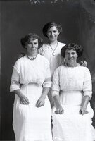 Three women in white dresses